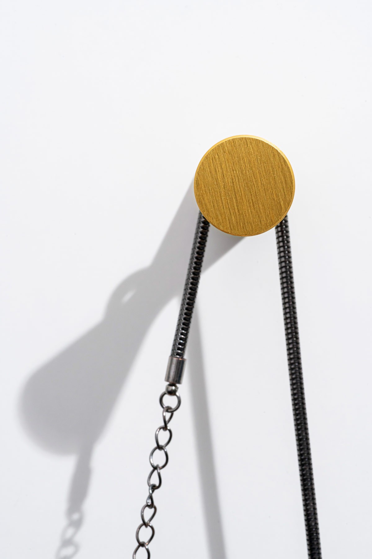 Diabolo wall hook brushed dark brass