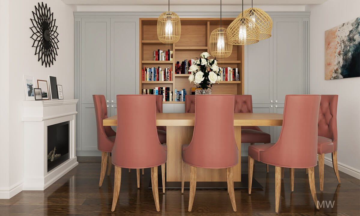 Dining room with oak table and bookshelves in the background