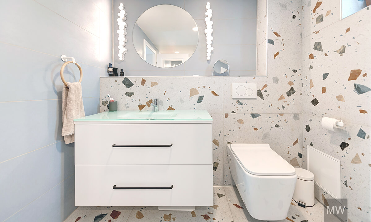 Stracciatella tiles with light blue bathroom