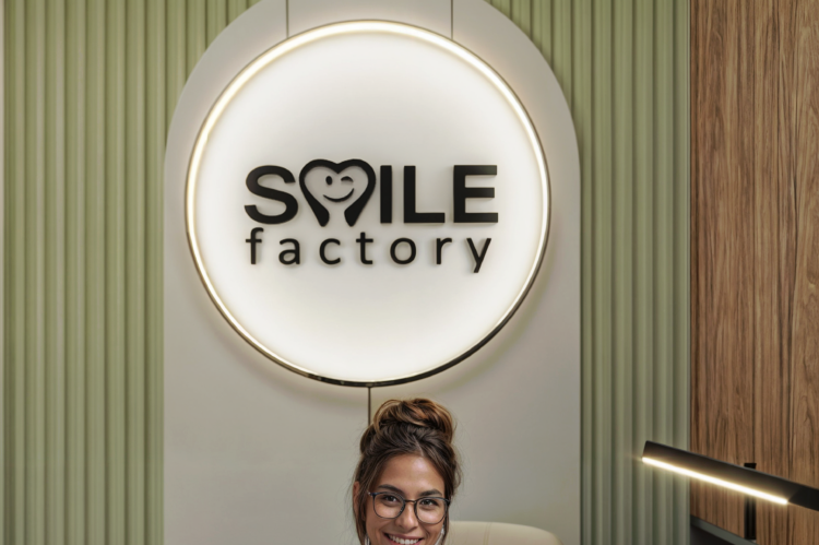 Round light fixture and custom wall paneling to emphasize the logo