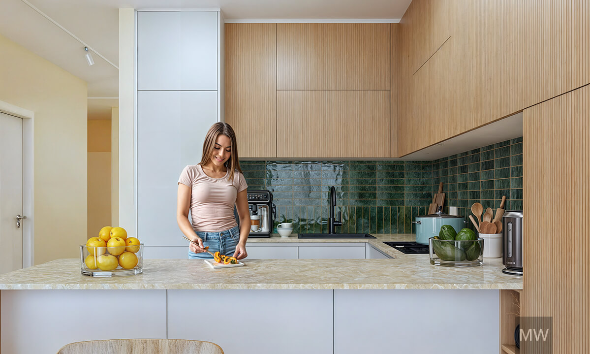 Kitchen with dark green tiles and marble worktop Modern kitchen with wood upper cabinets, Marble worktop and a woman cutting a fruit
