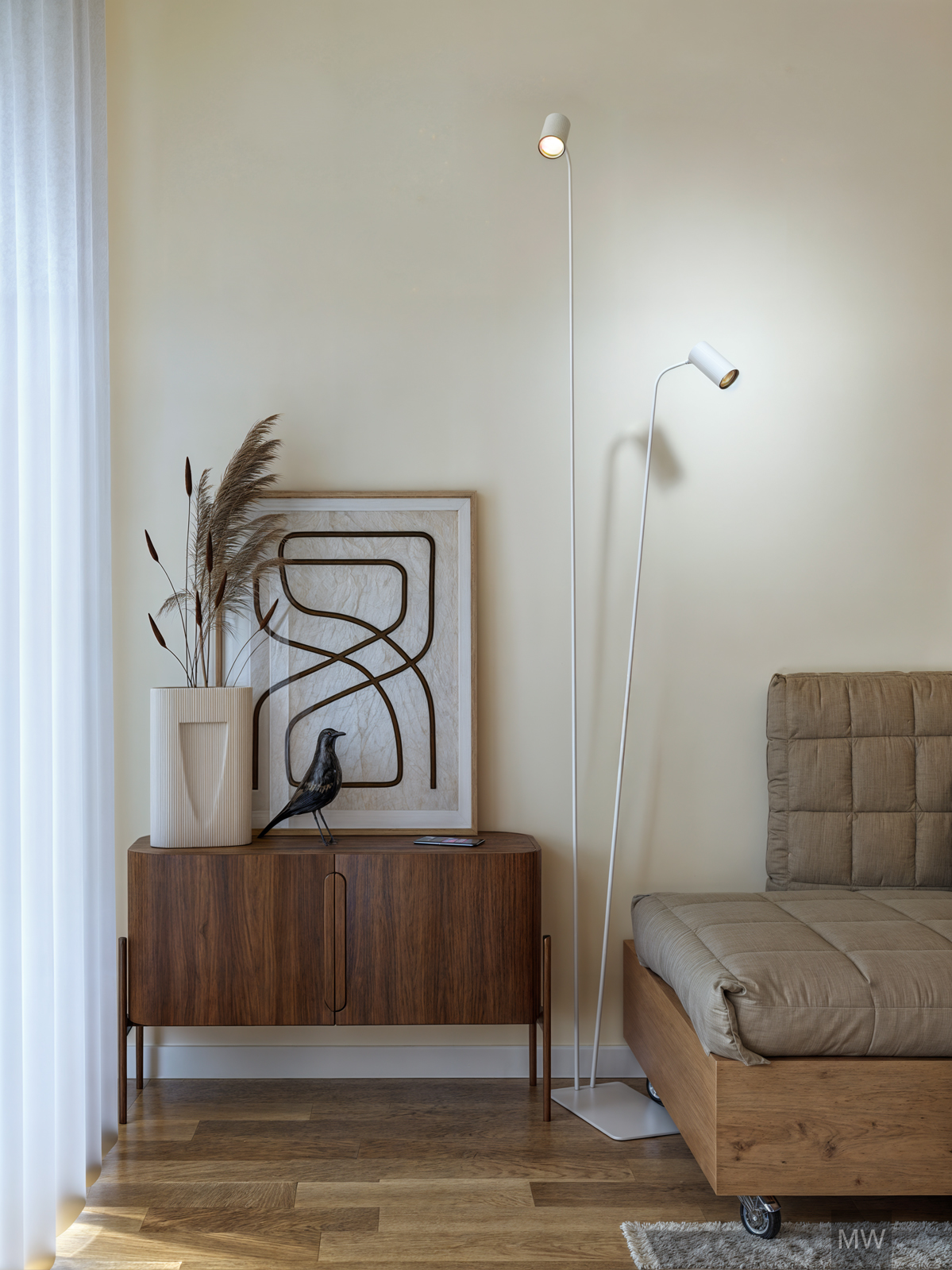Nice wood sideboard in living room corner Living room corner with a wooden side board, modern floor lamp, art and decoration.